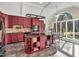 Well-appointed kitchen featuring a granite island with cooktop and seating, custom cabinets, and abundant natural light at 520 Log Barn Rd, Pittsboro, NC 27312
