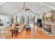 Spacious living room boasts a vaulted ceiling, hardwood floors, and a cozy fireplace at 520 Log Barn Rd, Pittsboro, NC 27312