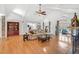 Living room boasts hardwood floors, neutral colors, and architectural columns with stone accents at 520 Log Barn Rd, Pittsboro, NC 27312