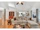 Large sectional sofa is the focal point of this bright living room with hardwood floors and vaulted ceiling at 520 Log Barn Rd, Pittsboro, NC 27312