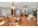 An open concept dining and living area featuring vaulted ceilings and lots of natural light at 520 Log Barn Rd, Pittsboro, NC 27312