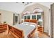 Spacious main bedroom with lots of natural light and hardwood floors at 520 Log Barn Rd, Pittsboro, NC 27312