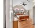 Large main bedroom featuring a ceiling fan, hardwood floors, and natural light at 520 Log Barn Rd, Pittsboro, NC 27312