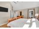 Neutral-toned main bedroom featuring hardwood floors and a view to the patio at 520 Log Barn Rd, Pittsboro, NC 27312