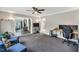 Open office space with views into an adjacent living area at 520 Log Barn Rd, Pittsboro, NC 27312