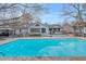 Sparkling pool with an adjacent deck featuring a hot tub, perfect for relaxation and entertaining at 520 Log Barn Rd, Pittsboro, NC 27312