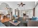 Relaxing sunroom featuring wicker seating, flagstone flooring, and views into the connected rooms at 520 Log Barn Rd, Pittsboro, NC 27312