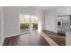 Sunlit dining area with hardwood floors and sliding glass door leading to a deck at 5322 River Reach Dr, Raleigh, NC 27616