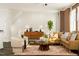 Bright living room with stylish furniture, area rug, and a decorative plant at 5322 River Reach Dr, Raleigh, NC 27616