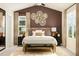 A beautiful main bedroom suite featuring a decorative wall, large windows and a cozy sitting bench at 5322 River Reach Dr, Raleigh, NC 27616