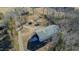 Aerial shot of the large metal building with gravel parking area at 5436 New Oak Trl, Burlington, NC 27217