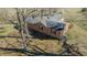High angle shot showing the roof line, shady backyard, and fence perimeter at 5436 New Oak Trl, Burlington, NC 27217