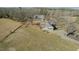 Aerial view of homes and land, nestled among mature trees at 5436 New Oak Trl, Burlington, NC 27217