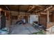 Spacious barn interior featuring wooden stalls and ample storage space at 5436 New Oak Trl, Burlington, NC 27217