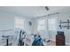 Bright bedroom with hardwood floors, three windows, and walls awaiting customization at 5436 New Oak Trl, Burlington, NC 27217