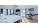 Bright bedroom with hardwood floors, exposed brick, blue curtains, patio access, and a drumset at 5436 New Oak Trl, Burlington, NC 27217