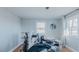 Bright bedroom with hardwood floors, two windows, and walls awaiting customization at 5436 New Oak Trl, Burlington, NC 27217