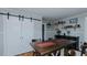Dining room with natural wood floors and custom sliding door at 5436 New Oak Trl, Burlington, NC 27217