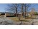 Charming single-story home, trees, gravel driveway, and partial brick facade offers curb appeal at 5436 New Oak Trl, Burlington, NC 27217