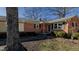 Charming brick home featuring a covered entryway, well-maintained landscaping, and a welcoming facade at 5436 New Oak Trl, Burlington, NC 27217