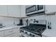 Updated kitchen with stainless appliances, marble countertops, and open dining space at 5436 New Oak Trl, Burlington, NC 27217
