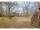 Expansive backyard featuring mature trees, offering a serene and private outdoor space at 7 Harrigan Ct, Durham, NC 27705
