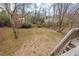 View of the spacious backyard from the wooden deck at 7 Harrigan Ct, Durham, NC 27705