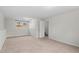 Finished basement with carpeting, a window, and access to the upper level via stairs at 7 Harrigan Ct, Durham, NC 27705