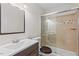 Bathroom with a glass shower door, vanity, and decorative mirror at 7 Harrigan Ct, Durham, NC 27705