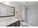 Bathroom with a walk-in shower, granite vanity, and modern fixtures at 7 Harrigan Ct, Durham, NC 27705