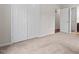 Spacious bedroom with carpet flooring, closet and a view to the hallway at 7 Harrigan Ct, Durham, NC 27705