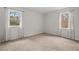 Bedroom with carpet, light walls and two windows with curtains at 7 Harrigan Ct, Durham, NC 27705