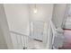 Bright foyer featuring a white door with decorative glass, tiled flooring, and a staircase at 7 Harrigan Ct, Durham, NC 27705