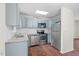 Charming kitchen featuring stainless steel appliances, granite counters, and ample cabinet space at 7 Harrigan Ct, Durham, NC 27705