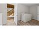 Well-lit laundry room with modern washer and dryer, and exterior access at 7 Harrigan Ct, Durham, NC 27705