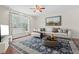Comfortable living room showcasing a neutral color palette, hardwood floors, and a large window at 7 Harrigan Ct, Durham, NC 27705