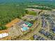 Aerial view of community amenities including a pool, playground, and tennis courts at 705 Vine Pkwy, Pittsboro, NC 27312
