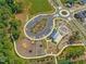 Aerial view of community amenities including a playground, parking, and green spaces at 705 Vine Pkwy, Pittsboro, NC 27312