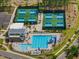 Aerial view of the pool and pickleball courts, surrounded by the neighborhood at 705 Vine Pkwy, Pittsboro, NC 27312