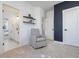 Stylish bedroom with an attached bathroom, modern decor, carpet floors, and neutral gray color palette at 705 Vine Pkwy, Pittsboro, NC 27312