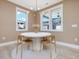 Cozy breakfast nook with natural light, modern lighting, and outdoor views at 705 Vine Pkwy, Pittsboro, NC 27312