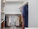 Organized walk-in closet with ample hanging space and shelving for clothing and shoes at 705 Vine Pkwy, Pittsboro, NC 27312
