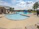 Full community pool view, with lounge seating and a zero-entry area, and neighborhood homes in background at 705 Vine Pkwy, Pittsboro, NC 27312