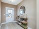 Charming entryway with a decorative mirror, stylish console table, and a welcoming atmosphere at 705 Vine Pkwy, Pittsboro, NC 27312
