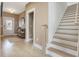 Inviting foyer showcasing an entryway, staircase, and seamless transition to the home's interior spaces at 705 Vine Pkwy, Pittsboro, NC 27312