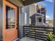 Stylish front door with a modern design and a welcoming entryway, complemented by well-maintained landscaping at 705 Vine Pkwy, Pittsboro, NC 27312