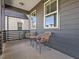 Cozy front porch featuring stylish outdoor seating, perfect for enjoying the fresh air and neighborhood views at 705 Vine Pkwy, Pittsboro, NC 27312