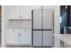 Modern kitchen with white cabinetry and stainless steel appliances at 705 Vine Pkwy, Pittsboro, NC 27312