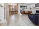 Open concept living room with dining area, modern light fixture, couch, and access to patio at 705 Vine Pkwy, Pittsboro, NC 27312