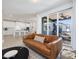 Open concept living room with access to a modern kitchen and outdoor patio at 705 Vine Pkwy, Pittsboro, NC 27312